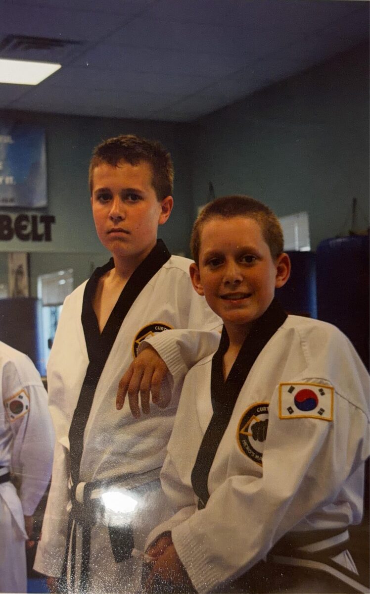 Justin and a fellow student in white gis with black belts